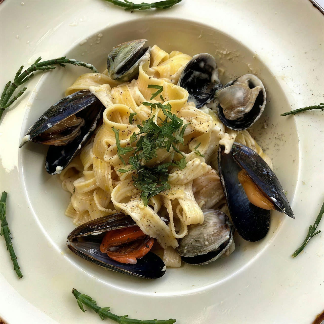 Fresh tagliatelle with mussels in a creamy sauce at Chaplais Kitchen